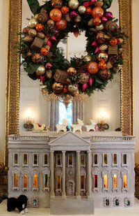 A nearly 300-pound White House gingerbread house sits in the State Dining Room.