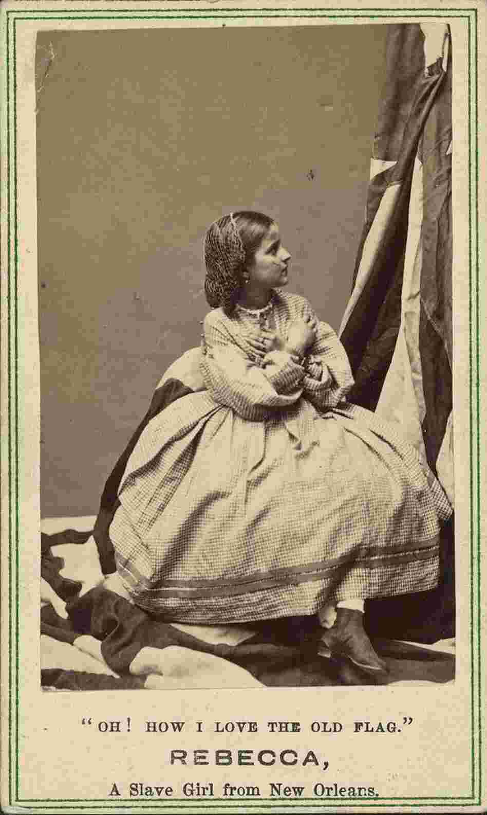 Rebecca Huler, her arms crossed over her chest, while she looks up at the flag. Rebecca Huler, her arms crossed over her chest, while she looks up at the flag.