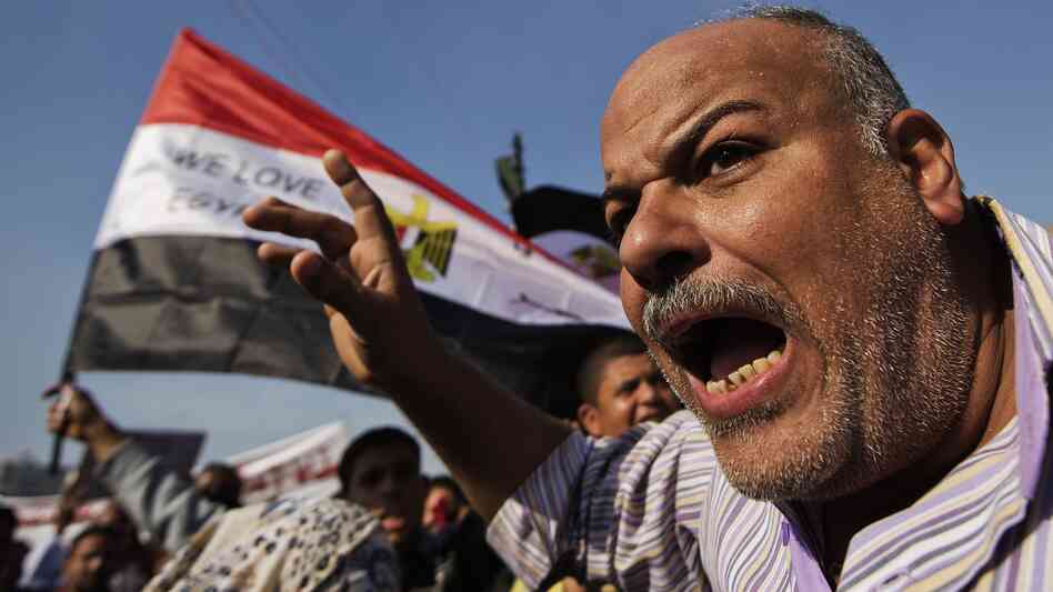 A protester shouts early Friday in Cairo's Tahrir Square.
