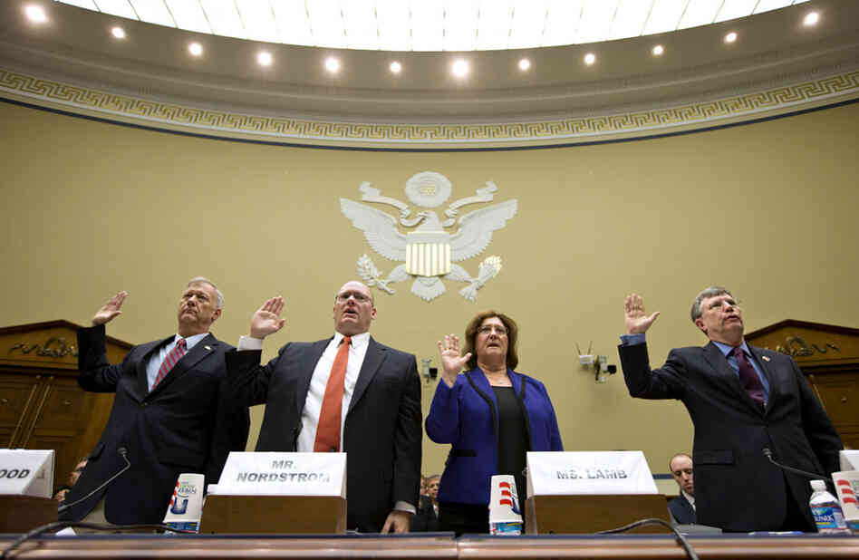Witnesses are sworn in on Capitol Hill on Oct. 10, before testifying at a House Oversight and Government Reform Committee hearing on the attack on the U.S. Consulate in Benghazi, Libya.