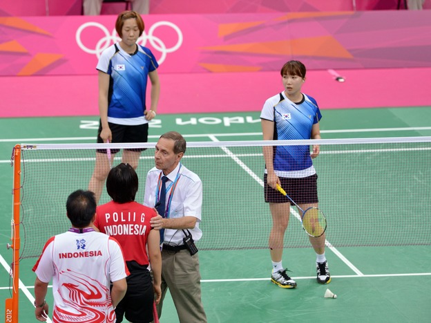 Referee Torsten Berg tried to get players from Indonesia (near court) and South Korea to try their hardest during this match at the London Olympics. The format gave some teams an incentive to lose — in order to get easier opponents in upcoming matches. That format's being changed.