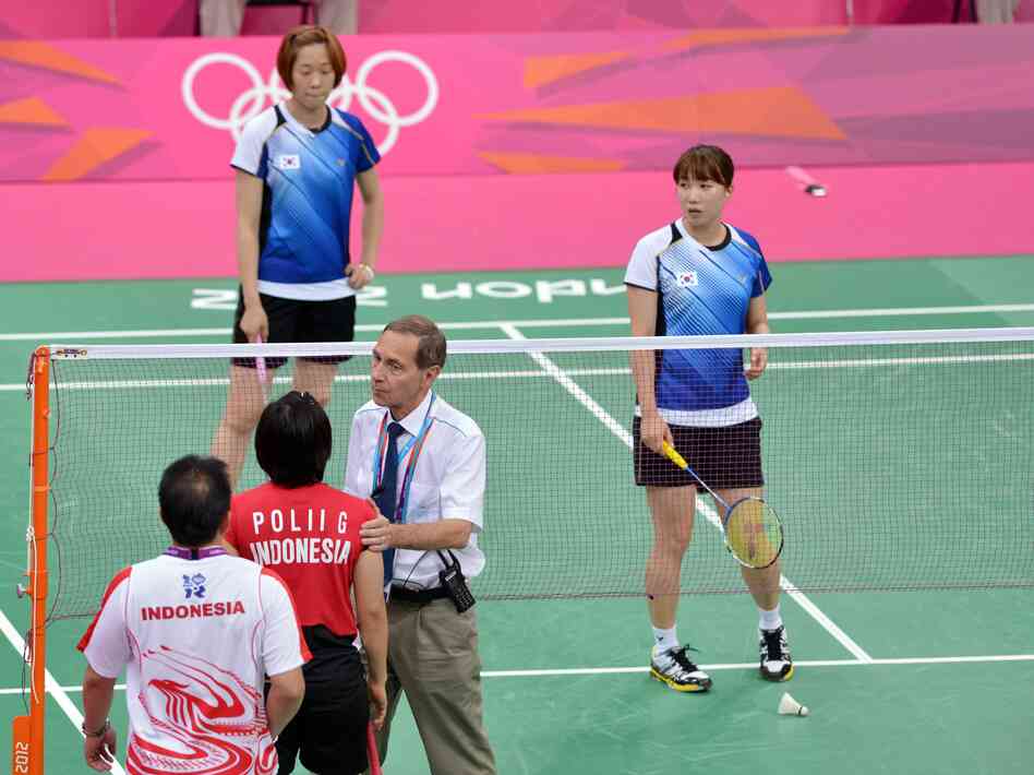 Referee Torsten Berg tried to get players from Indonesia (near court) and South Korea to try their hardest during this match at the London Olympics. The format gave some teams an incentive to lose — in order to get easier opponents in upcoming matches. That format's being changed.