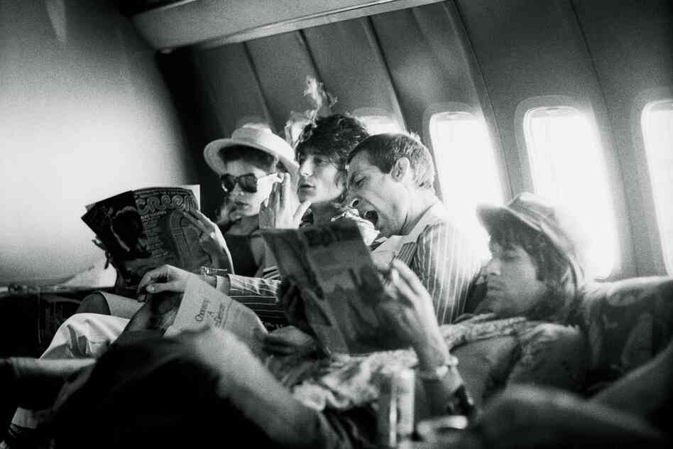 Tour of the Americas, on the plane between San Antonio and Kansas City,June 1975, (left to right) Bianca Jagger, Ron Wood, Charlie Watts and Keith Richards.