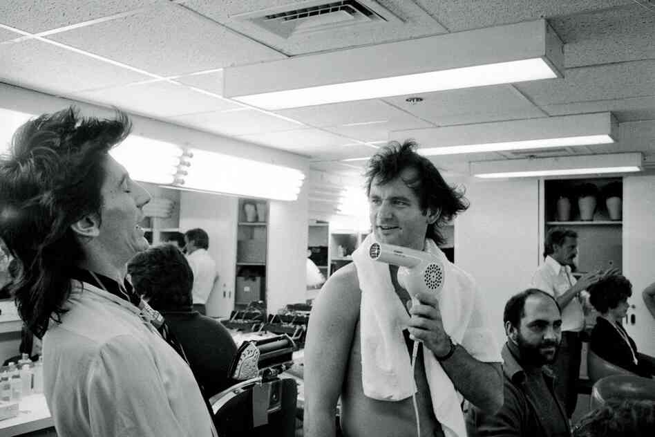 The Rolling Stones on Saturday Night Live, 1978. Bill Murray blow-drying Ron Wood's hair.