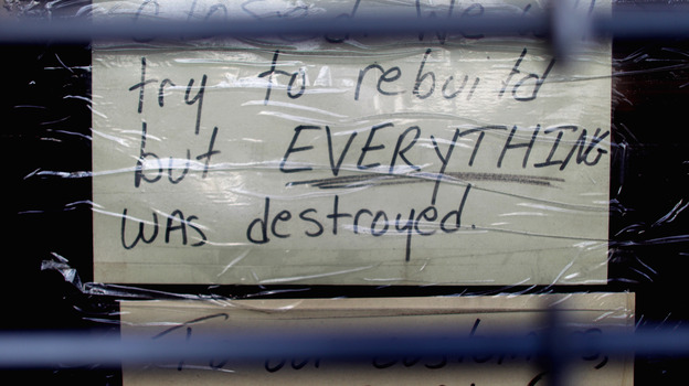 Nov. 17: A sign in a Staten Island storefront tells a lot. It was still closed because of the damage done by Superstorm Sandy in late October.
