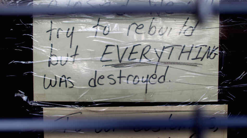 Nov. 17: A sign in a Staten Island storefront tells a lot. It was still closed because of the damage done by Superstorm Sandy in late October.