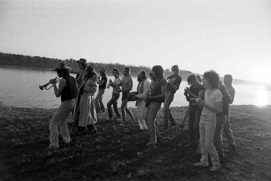 "Merry players" on the beach, Bob playing trumpet. Thanksgiving, 1975, Sturbridge, Mass.