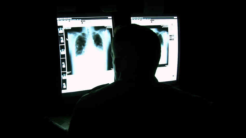 Who's there? A radiologist studies digital X-rays in a viewing room at what is now called the Walter Reed National Military Medical Center in Bethesda, Md. Who's there? A radiologist studies digital X-rays in a viewing room at what is now called the Walter Reed National Military Medical Center in Bethesda, Md.