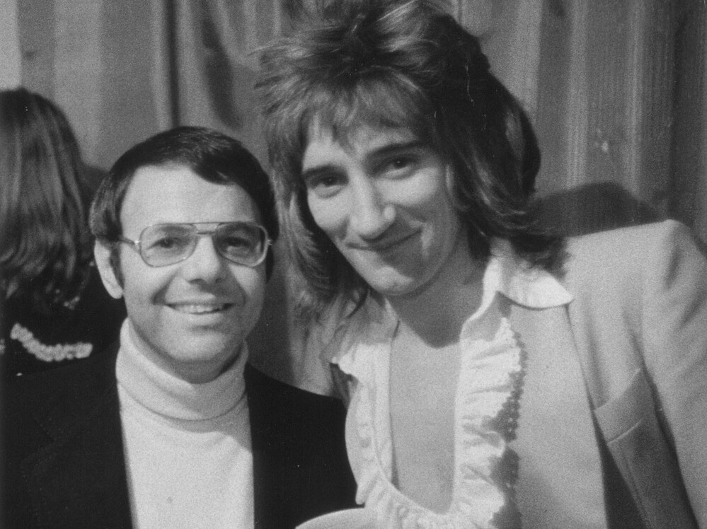 Joe Smith poses with Rod Stewart, circa 1974. The former record executive conducted informal interviews with dozens of musicians in the mid-1980s.