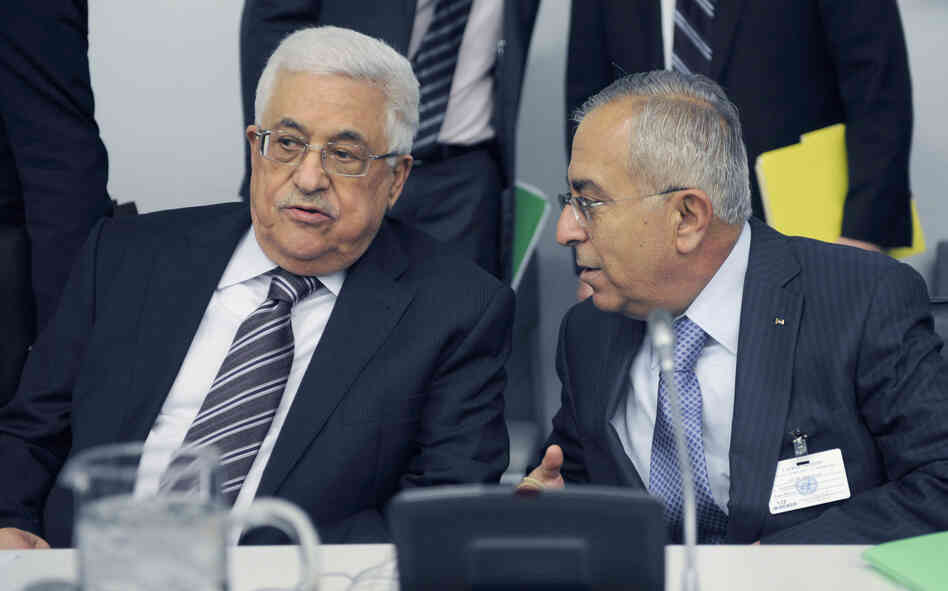Palestinian President Mahmoud Abbas (left) talks to Palestinian Prime Minister Salam Fayyad prior to the U.N. General Assembly vote on Thursday. Palestinian President Mahmoud Abbas (left) talks to Palestinian Prime Minister Salam Fayyad prior to the U.N. General Assembly vote on Thursday.