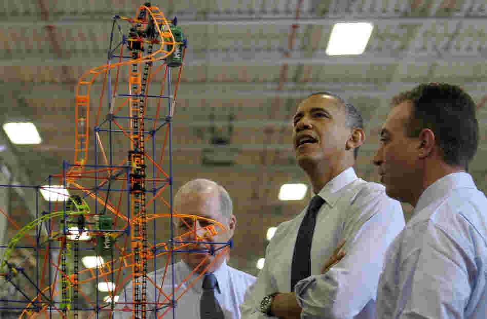 President Obama looks over a roller coaster with K'Nex inventor and Chairman Joel Glickman (left) and President and CEO Michael Araten on Friday during a tour of the company in Hatfield, Pa.