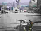 Afghan security forces block the road where Taliban suicide bombers attacked a joint U.S.- Afghan air base in Jalalabad, east of Kabul, Afghanistan on Sunday.