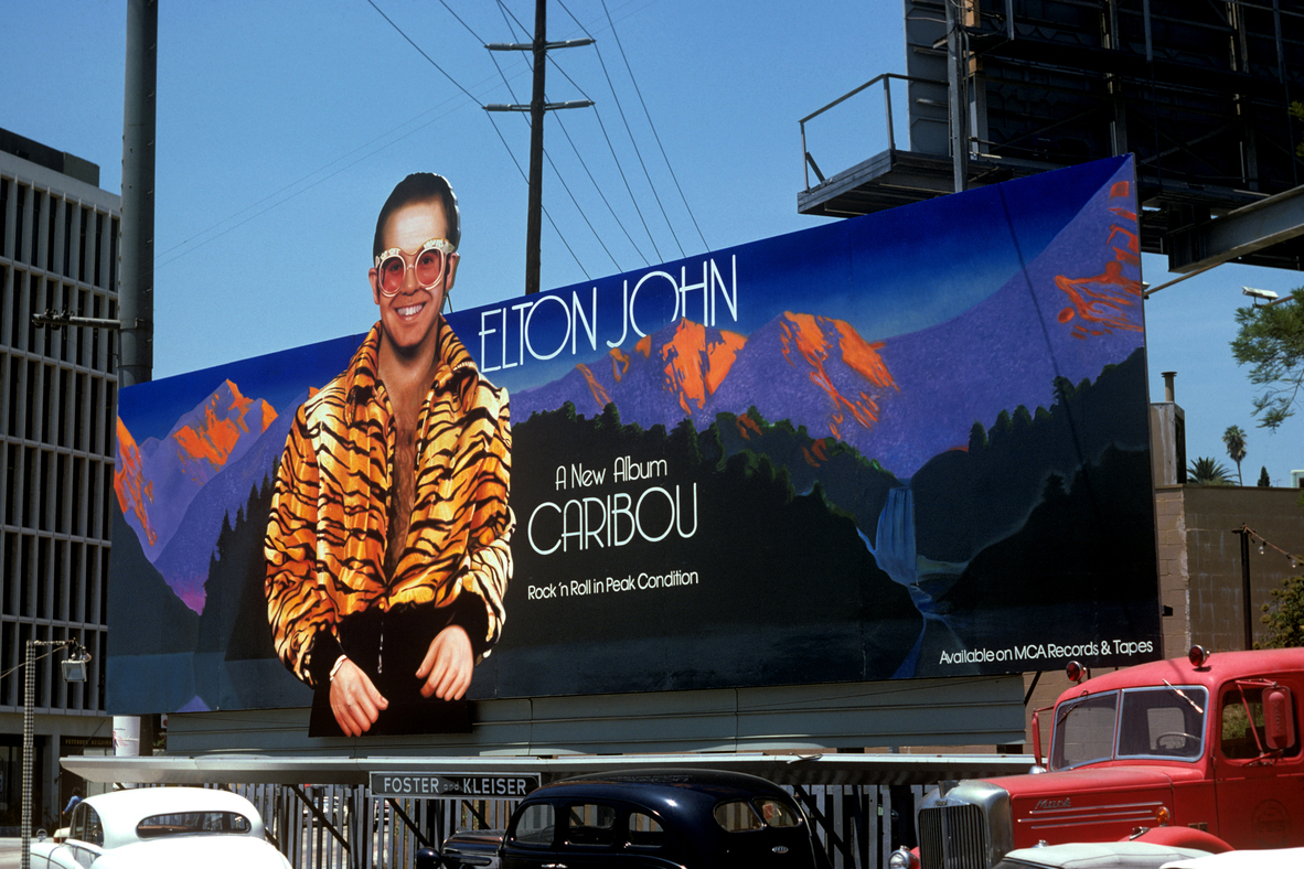 Elton John's Caribou, 1974 (MCA Records), art direction by David Larkham and Michael Ross, photo by Ed Caraeff, art by Chris Denney.