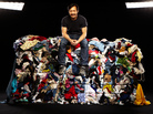 Wesley Law poses atop one of the bales in the Goodwill Outlet store in St. Louis. Wesley Law poses atop one of the bales in the Goodwill Outlet store in St. Louis.