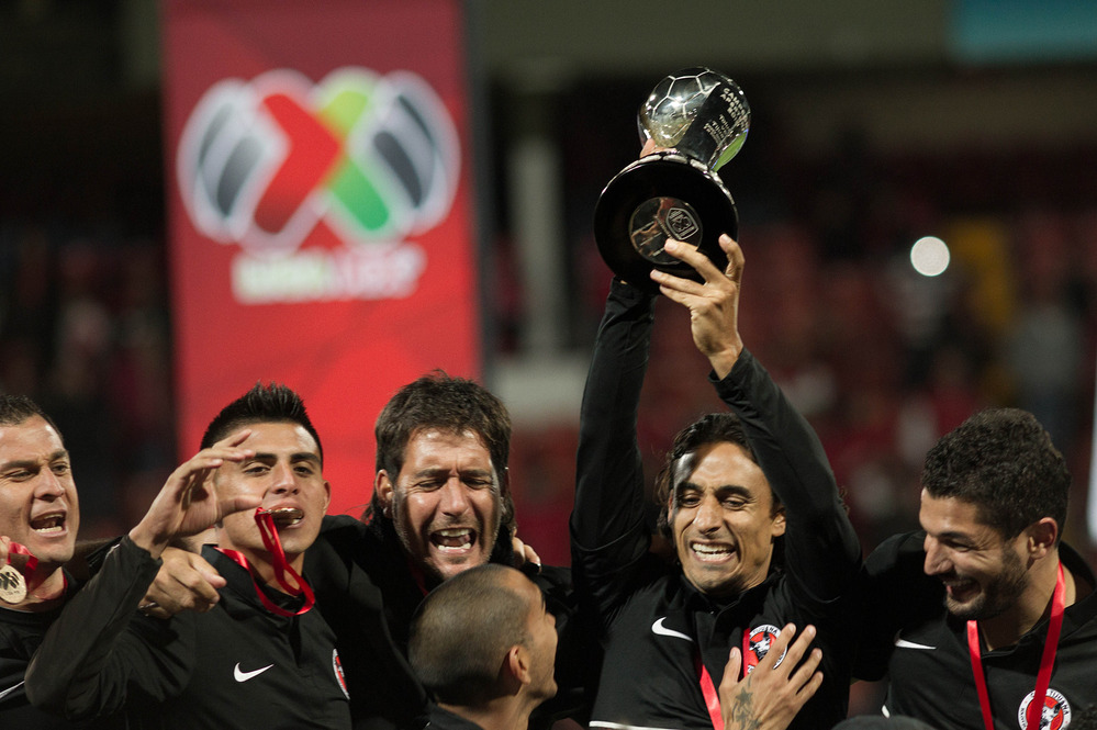 Players of Tijuana celebrate their victory over Toluca after their Mexican Apertura tournament final football match on Sunday. Players of Tijuana celebrate their victory over Toluca after their Mexican Apertura tournament final football match on Sunday.