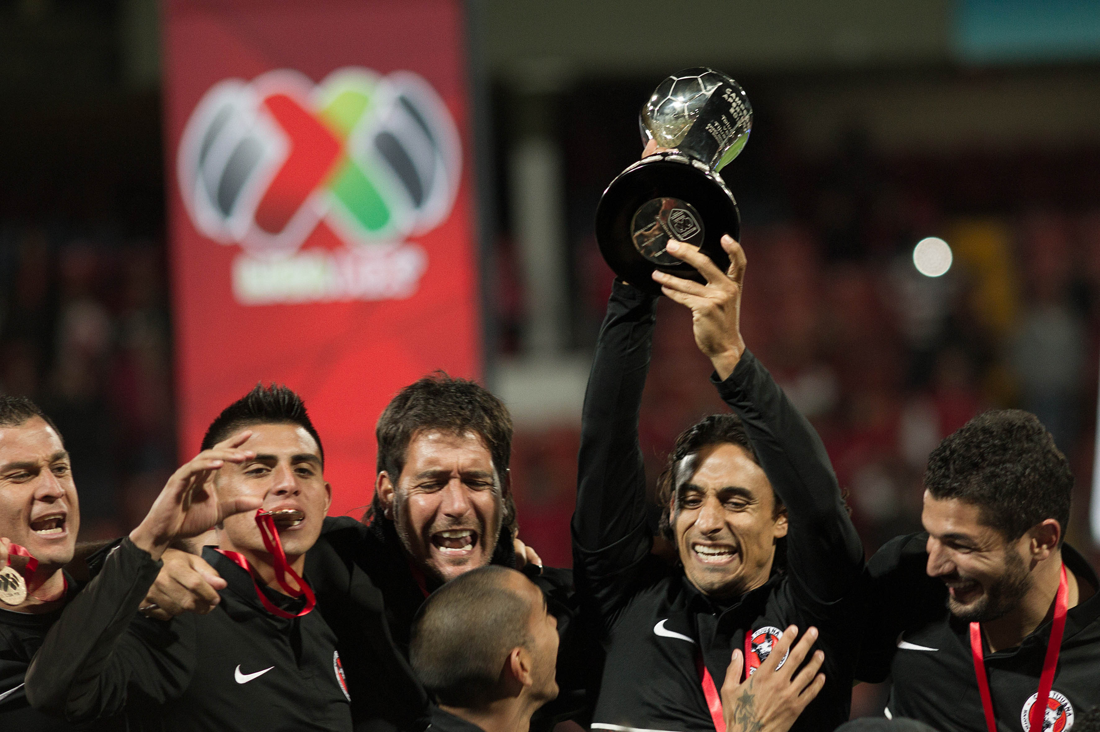 Players of Tijuana celebrate their victory over Toluca after their Mexican Apertura tournament final football match on Sunday. Players of Tijuana celebrate their victory over Toluca after their Mexican Apertura tournament final football match on Sunday.