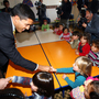 Rajiv Shah (left), the head of USAID, speaks with children during a visit at the Oncupinar Syrian refugee camp in Turkey, near the Syrian border, on Nov. 27.
