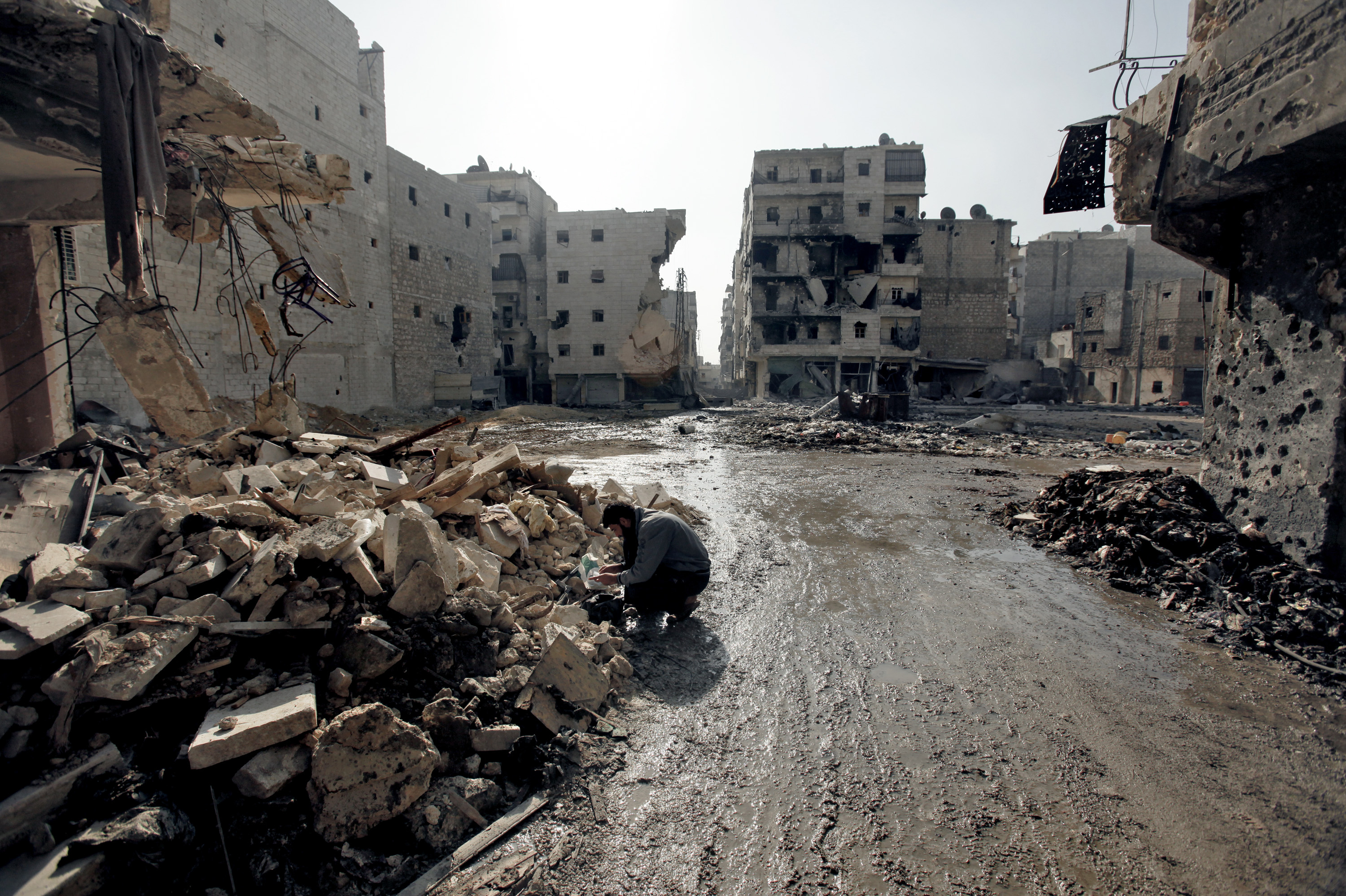 A man is seen in the al-Amirya neighborhood of the city of Aleppo on Sunday. Syrian artillery and aircraft also battered rebel positions in and around Damascus in an operation to secure the capital. A man is seen in the al-Amirya neighborhood of the city of Aleppo on Sunday. Syrian artillery and aircraft also battered rebel positions in and around Damascus in an operation to secure the capital.