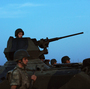 Turkish soldiers stand guard in the town of Akcakale, just across the border from Syria, on Oct. 4. The Turks have often issued stern warnings and retaliated when shooting from the Syrian war has come across their border. But Turkey did not respond to an incident over the weekend.