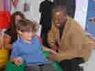 LeVar Burton and 7 year old Shane Ammon exploring the all Reading Rainbow adventure app at the "Reading Rainbow Relaunch" event in June.