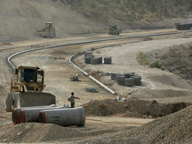 Construction workers are seen at the E1 construction site near the West Bank settlement of Maaleh Adumim on the eastern outskirts of Jerusalem in 2007.