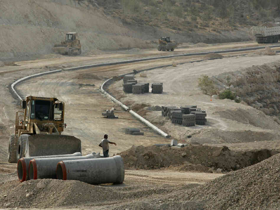 Construction workers are seen at the E1 construction site near the West Bank settlement of Maaleh Adumim on the eastern outskirts of Jerusalem in 2007.