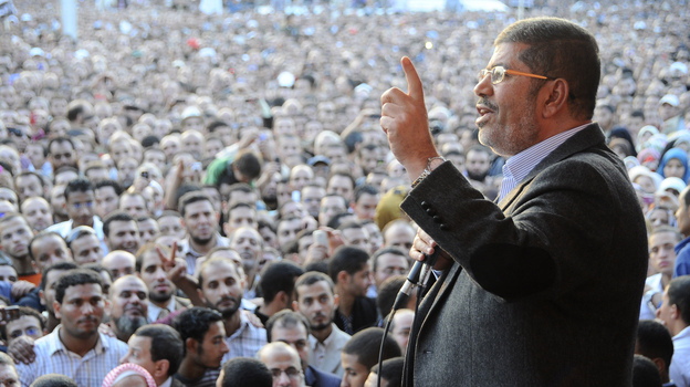 Egyptian President Mohammed Morsi speaks to supporters outside the presidential palace in Cairo on Nov. 23, a day after he issued decrees that gave him sweeping powers.