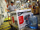 Home Depot has long offered credit cards, partly to serve customers who have just suffered major house damage. The company has recently widened those efforts. Here, a Tampa, Fla., customer buys a generator and bottled water, preparing for Tropical Storm Isaac's arrival in August. Home Depot has long offered credit cards, partly to serve customers who have just suffered major house damage. The company has recently widened those efforts. Here, a Tampa, Fla., customer buys a generator and bottled water, preparing for Tropical Storm Isaac's arrival in August.