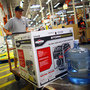 Home Depot has long offered credit cards, partly to serve customers who have just suffered major house damage. The company has recently widened those efforts. Here, a Tampa, Fla., customer buys a generator and bottled water, preparing for Tropical Storm Isaac's arrival in August. Home Depot has long offered credit cards, partly to serve customers who have just suffered major house damage. The company has recently widened those efforts. Here, a Tampa, Fla., customer buys a generator and bottled water, preparing for Tropical Storm Isaac's arrival in August.