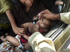 A child is inoculated with the polio vaccine at a traffic checkpoint just outside Pakistan's capital, Islamabad. Roadside vaccinations help health workers reach children in mobile populations. A child is inoculated with the polio vaccine at a traffic checkpoint just outside Pakistan's capital, Islamabad. Roadside vaccinations help health workers reach children in mobile populations.