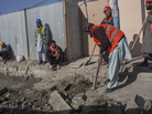 Afghan laborers work on a roads project last month in Kabul. A huge project to fix the city's roads and sewers is causing huge headaches. Afghan laborers work on a roads project last month in Kabul. A huge project to fix the city's roads and sewers is causing huge headaches.