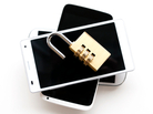 Mobile phones and a unlocked padlock Mobile phones and a unlocked padlock