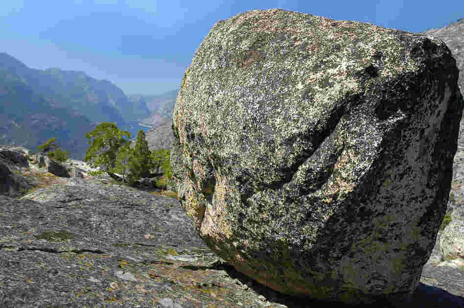 A glacial erratic with the Hetch-Hetchy Reservoir in the background. A glacial erratic with the Hetch-Hetchy Reservoir in the background.