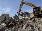 Cleanup continues on the site of a demolished home on the Rockaway Peninsula in New York on Nov. 29. Cleanup continues on the site of a demolished home on the Rockaway Peninsula in New York on Nov. 29.