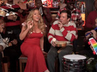 A screenshot of Jimmy Fallon and Mariah Carey performing "All I Want For Christmas Is You" with The Roots. A screenshot of Jimmy Fallon and Mariah Carey performing "All I Want For Christmas Is You" with The Roots.