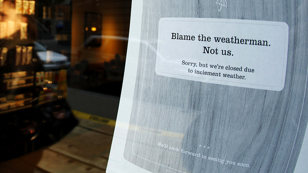 A "closed" sign at a coffee shop in New York City, where many businesses had to shut down for at least a few days before, during and after Superstorm Sandy.