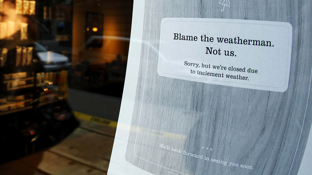 A "closed" sign at a coffee shop in New York City, where many businesses had to shut down for at least a few days before, during and after Superstorm Sandy.