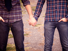 Two men holding hands Two men holding hands