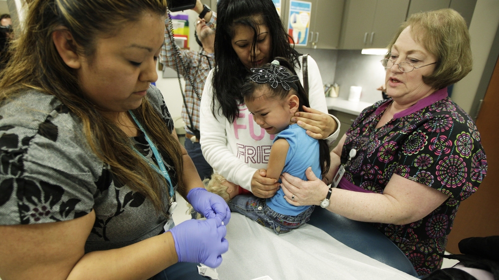 Kimberly Magdeleno, 4, braces herself for a whooping cough booster shot at a health clinic in Tacoma, Wash., in May.