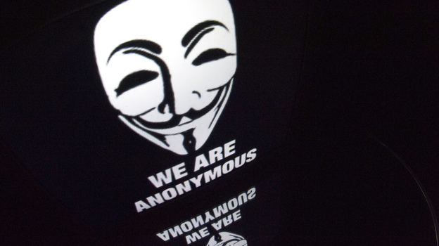 The "Anonymous" logo is seen on a tablet screen. (AFP/Getty Images)