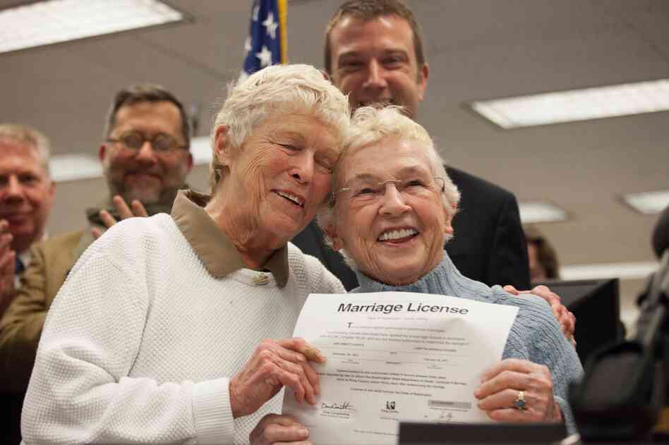 Jane Abbott Lighty, left, and Pete-e Petersen embrace after receiving the first same-sex marriage license in Washington state at the King County Recorder's Office in Seattle, Washington. Jane Abbott Lighty, left, and Pete-e Petersen embrace after receiving the first same-sex marriage license in Washington state at the King County Recorder's Office in Seattle, Washington.