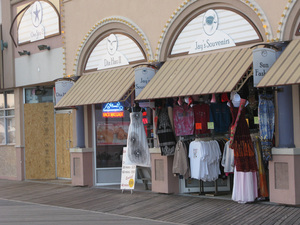 At Jay's Souvenirs on the boardwalk, Yaqob Abro says it costs him more to commute to work and keep the lights on than he's making in sales most days.