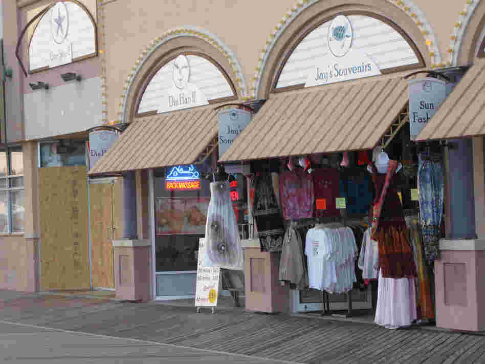 At Jay's Souvenirs on the boardwalk, Yaqob Abro says it costs him more to commute to work and keep the lights on than he's making in sales most days.