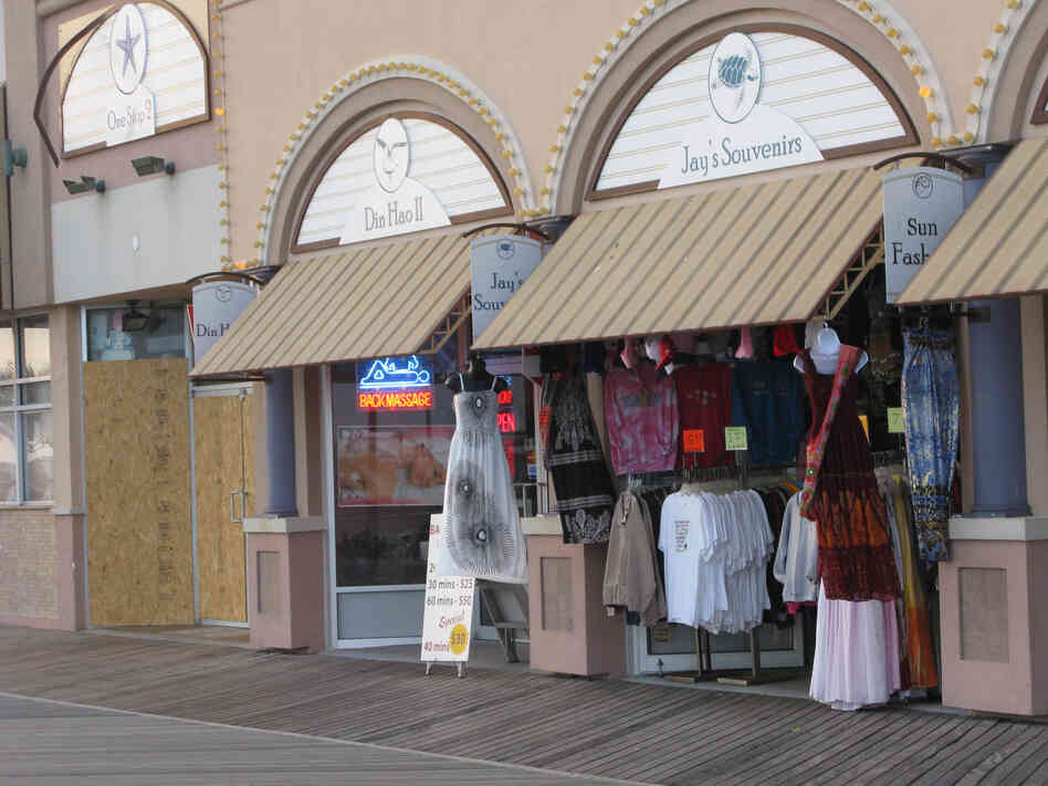 At Jay's Souvenirs on the boardwalk, Yaqob Abro says it costs him more to commute to work and keep the lights on than he's making in sales most days.
