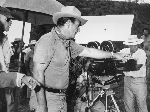 6-foot-4 actor John Wayne directs a scene for the Hollywood movie The Alamo in 1959. Wayne also portrays the reportedly 6-foot-tall Davy Crockett in the movie.