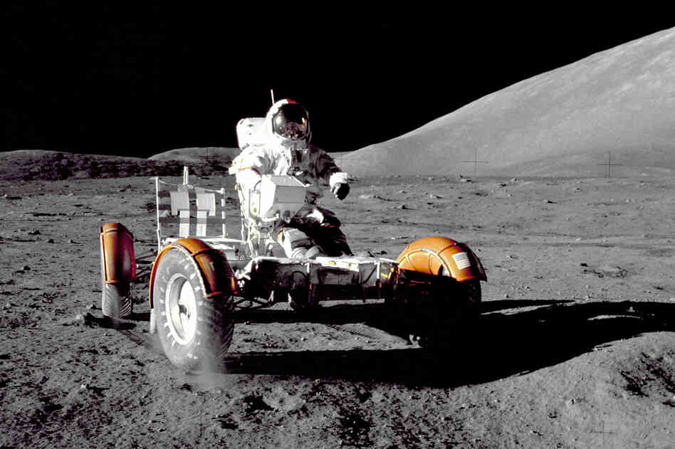 Cernan tests the lunar vehicle. He and Schmitt landed in the moon's Taurus-Littrow region. Evans stayed behind, orbiting the moon.