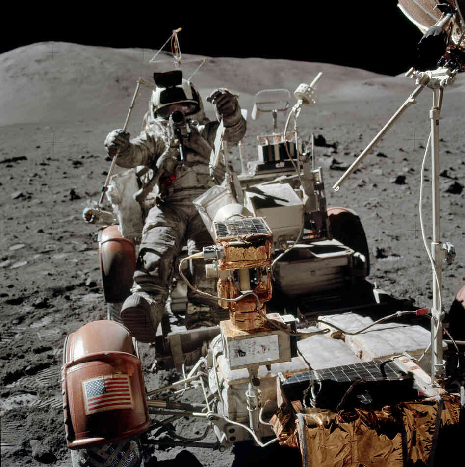 Cernan photographed Schmitt while he set up a transmitter used in a geological experiment.