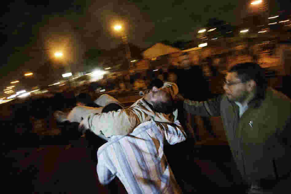 A man who had been with supporters of the Muslim Brotherhood when he was injured is carried from the scene.