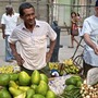 Cuba has relaxed some business rules, allowing street vendors to sell produce and a large wholesale produce market to open at night on the edge of Havana.