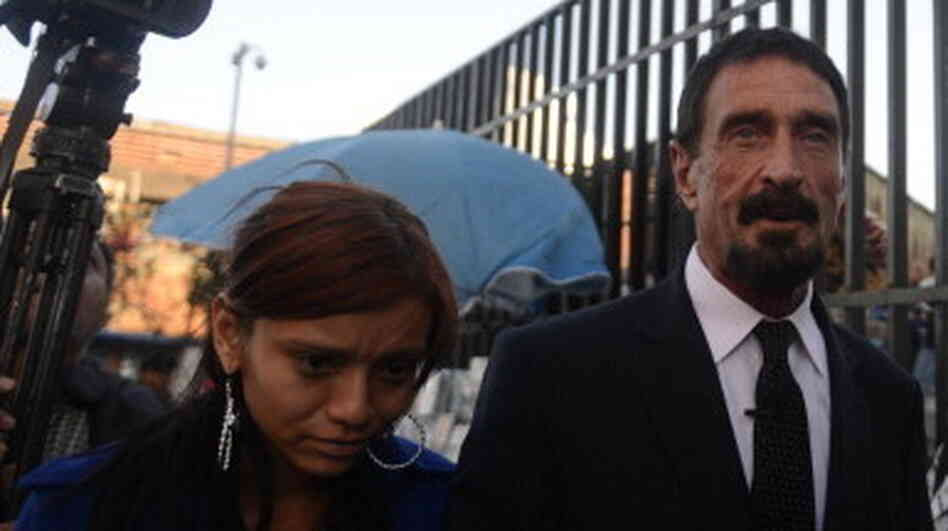 John McAfee, with a woman described as his girlfriend, on the way into the Supreme Court in Guatemala City on Tuesday. John McAfee, with a woman described as his girlfriend, on the way into the Supreme Court in Guatemala City on Tuesday.